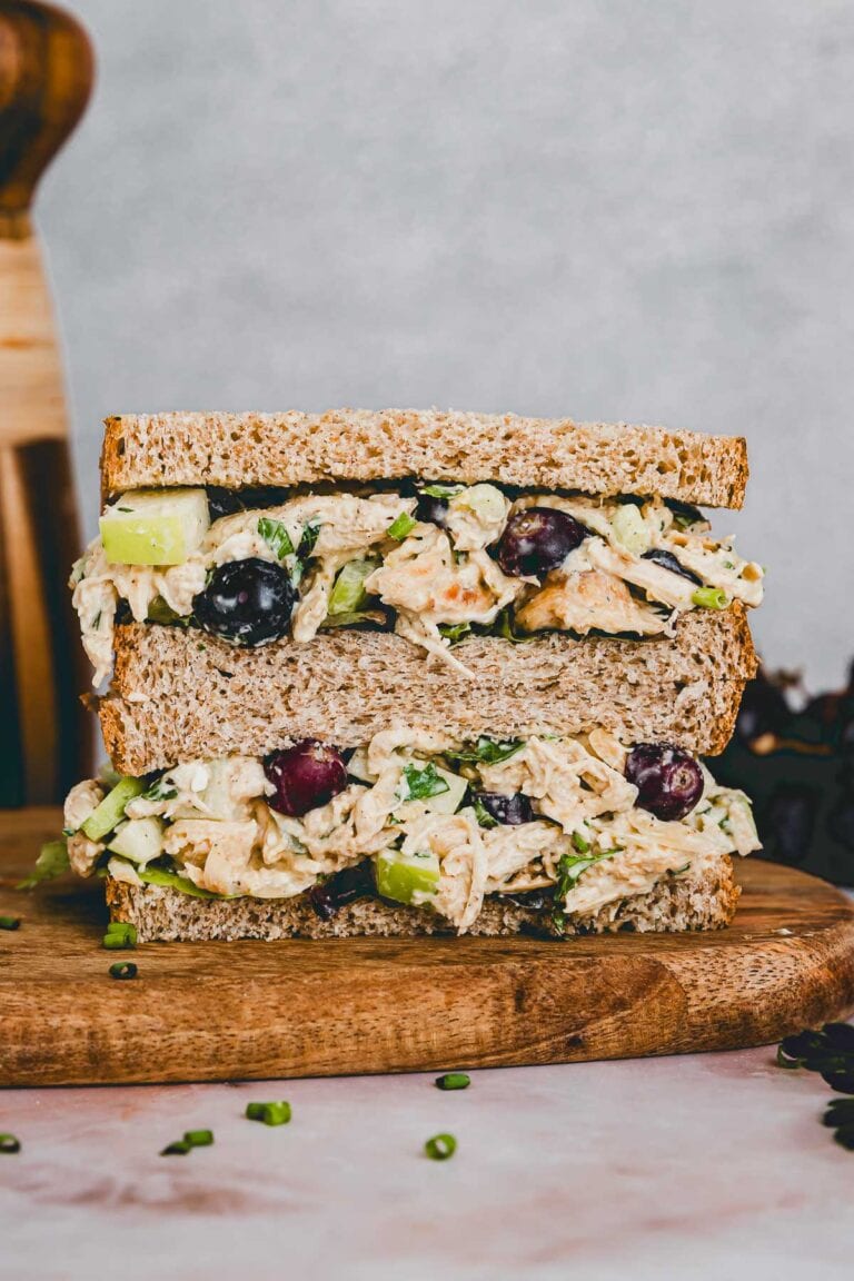 Cottage Cheese Chicken Salad sandwich on a cutting board